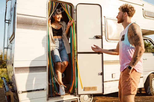 Preview: Multiracial couple smiling at each other by trailer