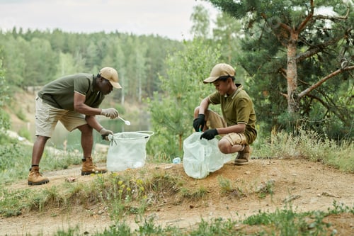Preview: Dad picking up garbage with his son