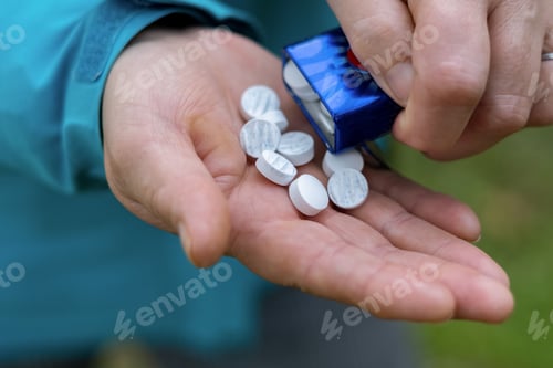 Preview: woman pouring mints into her hands