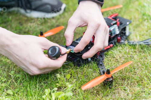 Preview: The guy fixes the sports drone closeup
