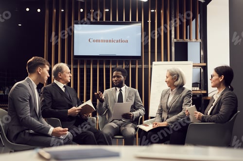 Preview: Group of business people discussing ideas at meeting