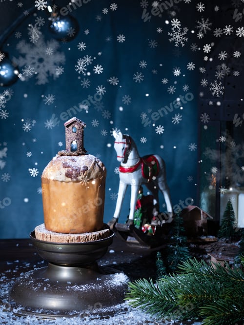 Preview: Christmas Italian sweet panetone and Christmas decorations. Snow in bokeh
