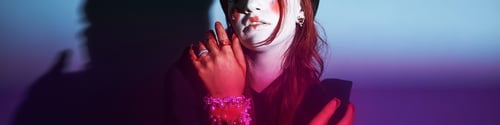Preview: Caucasian Teen Girl with Creative Makeup Posing Dramatically Indoors