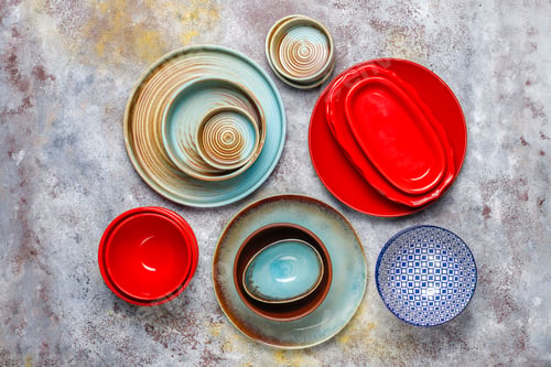 Preview: Different ceramic empty plates and bowls.