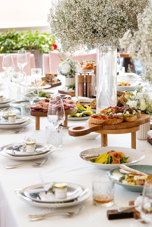 Preview: Served wedding table with decorative fresh white gypsophila flowers. Celebration details