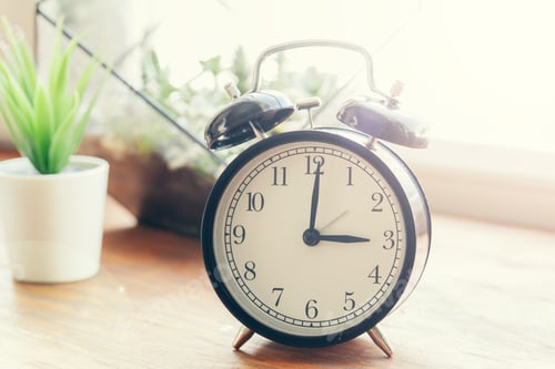 Preview: Morning sun. Alarm clock on a beautiful background