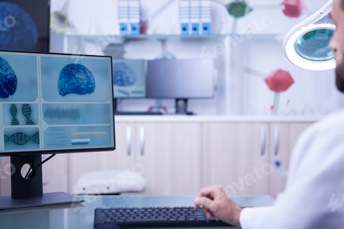 Preview: Photo of a brain x-ray examined by a young doctor