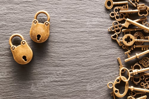 Preview: Various metal keys and locks on slate background
