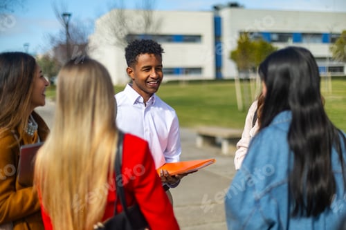 Preview: University students talking and smiling on campus