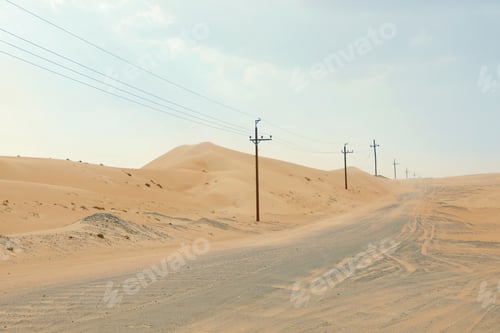 Preview: Electricity transmission line near road in desert