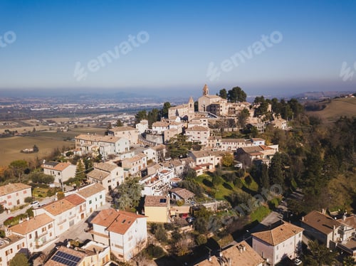 Preview: Aerial shot of the village of Montemaggiore al Metauro with a church and buildings with red roofs