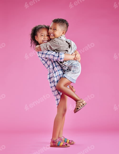 Preview: Two children only posing and being affectionate against a pink copyspace background. African Americ