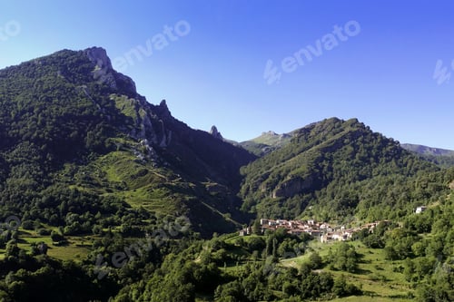 Preview: View of a mountain village under a clear blue sky in Cucayo, Liebana, Cantabria, Spain