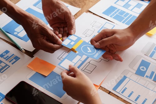 Preview: Group of ux developer and ui designer brainstorming about app interface design at modern office