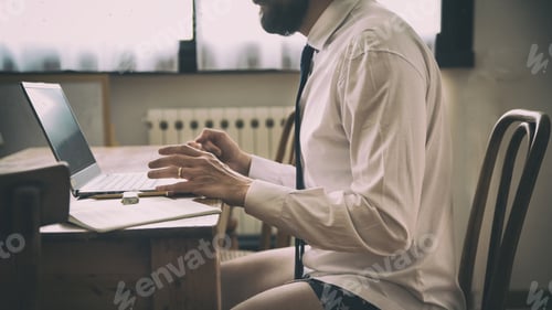 Preview: Bearded Man Working from Home in Underwear