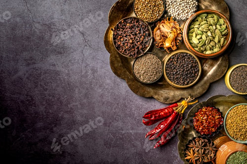 Preview: Top view of various Indian spices and seasonings on a table