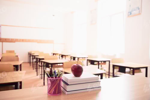 Preview: Classroom with Desks, Books, Apple, and Art Supplies