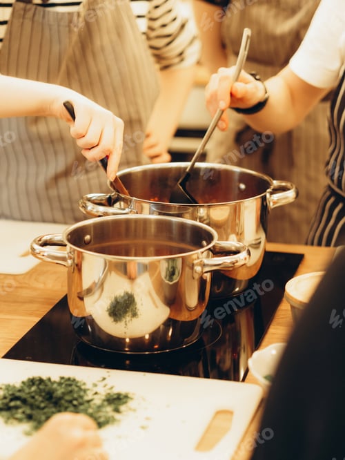 Preview: Uncertain womans preparing meal in the kitchen at home.