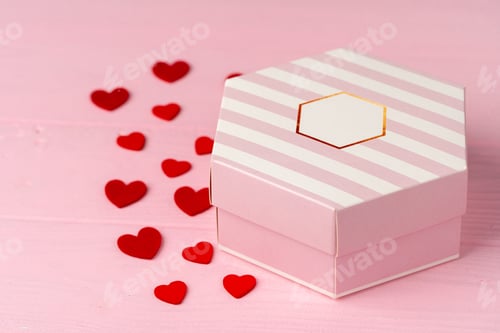 Preview: Wrapped gift for Valentine's day on wooden table