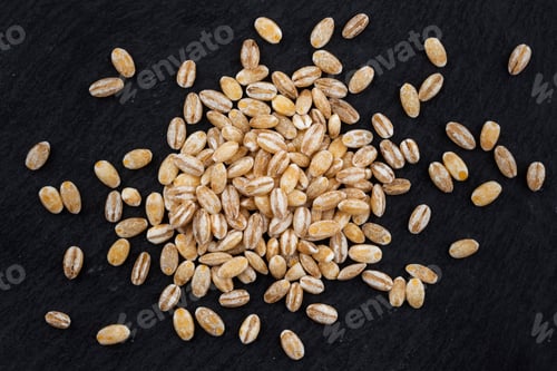 Preview: Pearl barley on black background. Top view