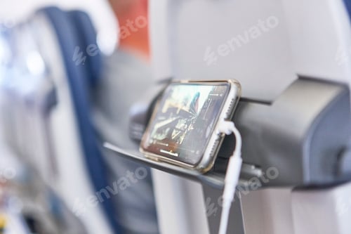 Preview: Airplane cabin interior with mobile phone charging batteries. Travel