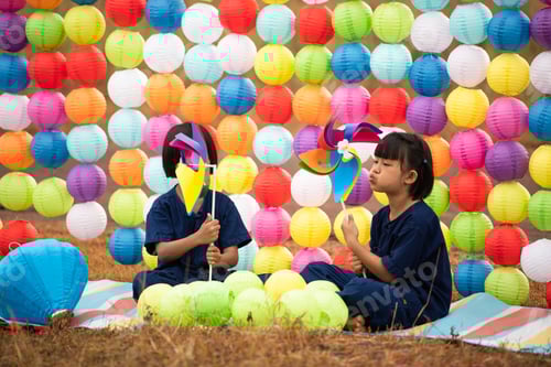 Preview: Childhood life in rural Thailand. A small child plays with colorful little hanging lamp
