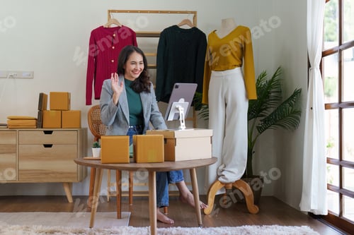 Preview: Asian Woman fashion designer cloth tailor creative working for new collection. Happy online store ow