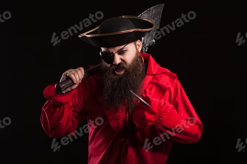 Preview: Portrait of a medieval bearded pirate on black background.