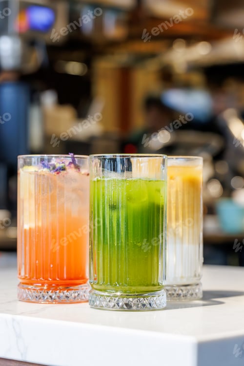 Preview: Assorted summer lemonades in glass jars with fresh fruits, ice, and garnishes