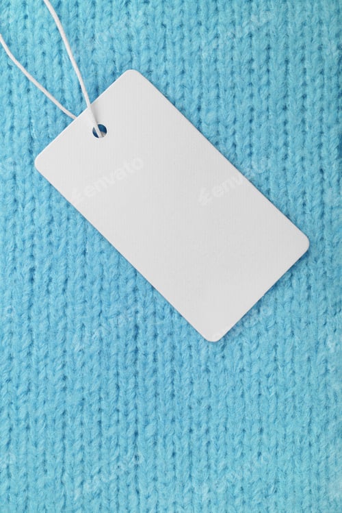 Preview: Template Of Blank Clothing Label, Price Tag On Turquoise Knitted Sweater Background