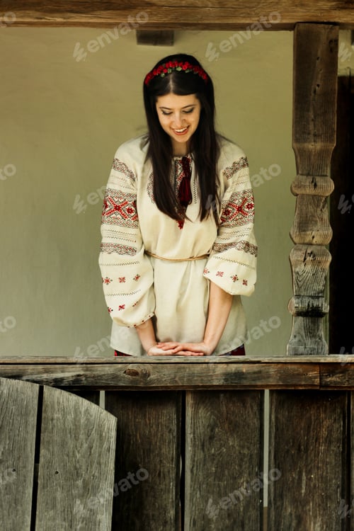 Preview: beautiful brunette woman in national ukrainian embroidery clothes