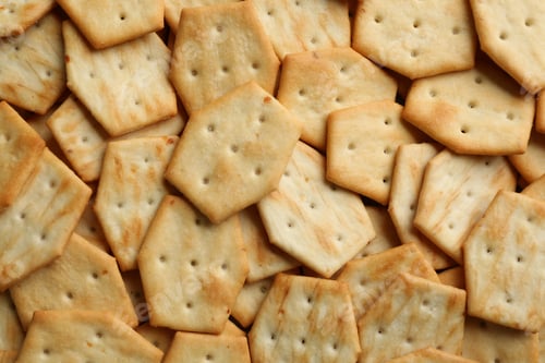 Preview: Many delicious crackers as background, top view