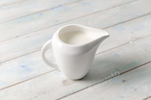 Preview: Jug of milk, on white table