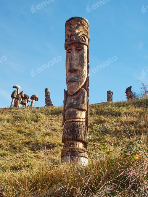 Preview: Totems handcrafted woodwork. Body shape. Smiling face. Carpentry workshop