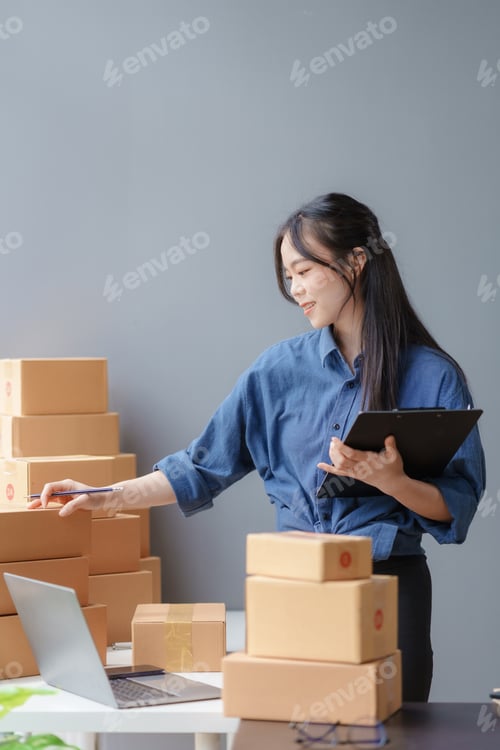 Preview: E-commerce Entrepreneurship. Asian Female Online Seller Packing Orders for Internet Sales