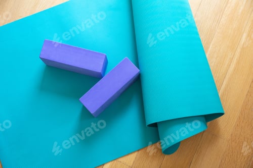 Preview: Yoga Mat and Blocks on Wooden Floor
