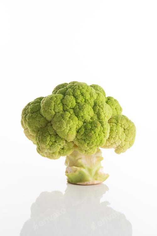 Preview: Fresh green broccoli without leaves on a white surface with white background