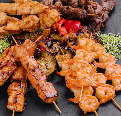 Preview: Colorful grilled skewers of shrimp, chicken, and beef