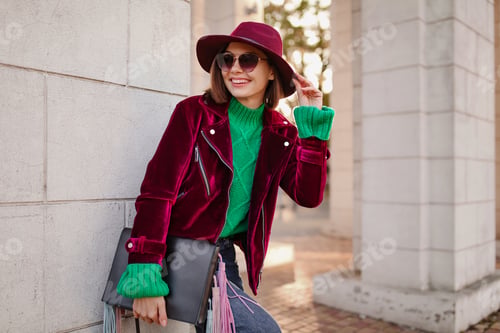 Preview: attractive woman in autumn style trendy outfit walking in street