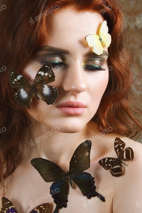 Preview: Portrait of tender girl with butterflies on her face and body