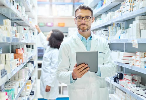 Preview: Shot of a mature man using a digital tablet to do inventory in a pharmacy