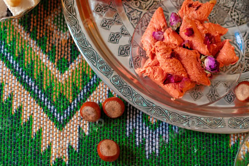 Preview: Sweet pink halva dessert slices on metal tray