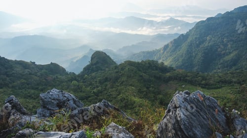 Preview: Aerial landscape view of the mountain range on foggy day