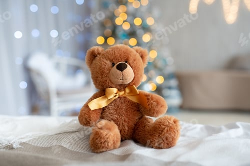 Preview: A cozy scene featuring a plush teddy bear in front of a decorated Christmas tree