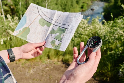 Preview: Compass and local map in camper hands