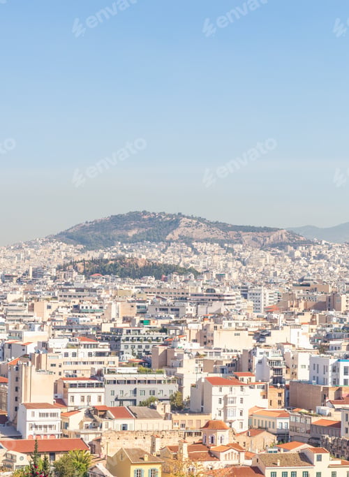 Preview: Athens Cityscape With Residential Rooftops and Distant Hill Under Clear Blue Sky, Greece