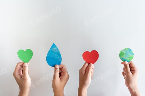 Preview: Hands holding earth, water drop, red heart and green heart shape. Concept of protecting the world.