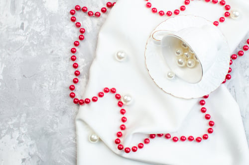 Preview: top view elegant cups with beautiful red beads on white surface horizontal food cuisine kitchen