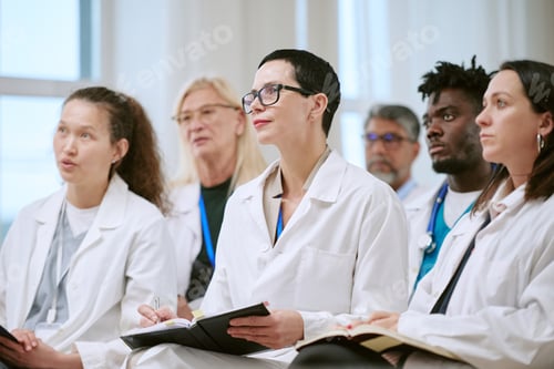 Preview: Diverse Group of Middle Aged Medical Professionals Attending Training Seminar