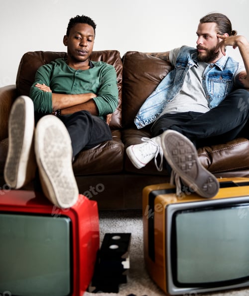 Preview: Two man sitting and two retro television